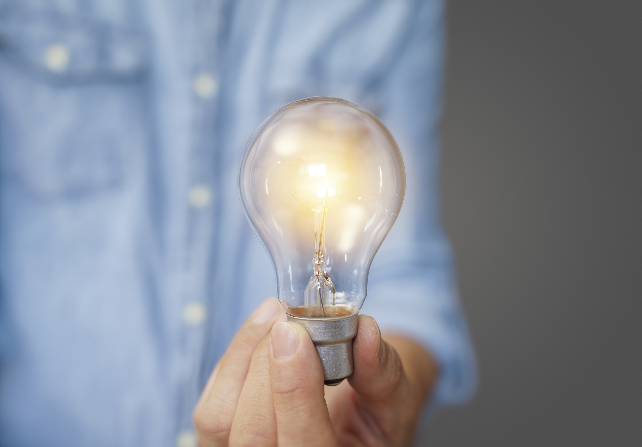 man holding light bulbs ideas new ideas with innovative technology creativity